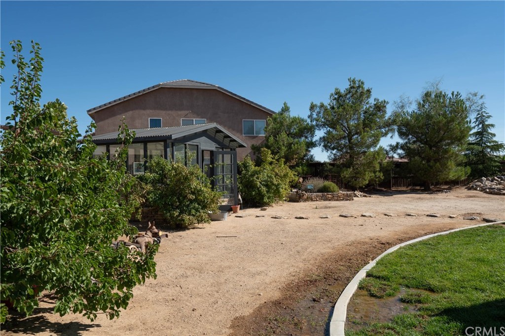 19032 Mono Drive Hesperia, CA 92345 - Photo 13 of 54 a front view of a house with a yard