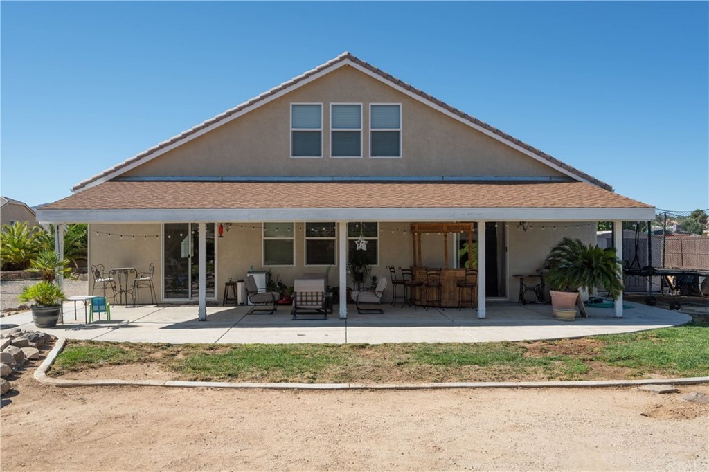 19032 Mono Drive Hesperia, CA 92345 - Photo 17 of 54 a front view of a house with a yard outdoor seating and slide