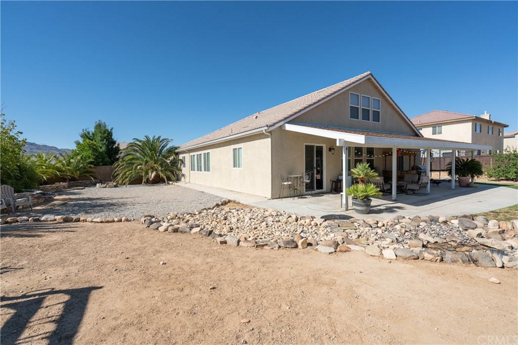 19032 Mono Drive Hesperia, CA 92345 - Photo 19 of 54 a front view of a house with a yard