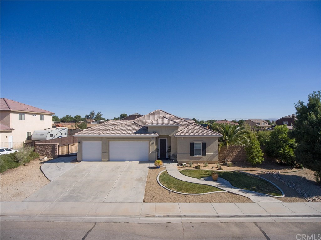 19032 Mono Drive Hesperia, CA 92345 - Photo 2 of 54 a front view of a house with a yard