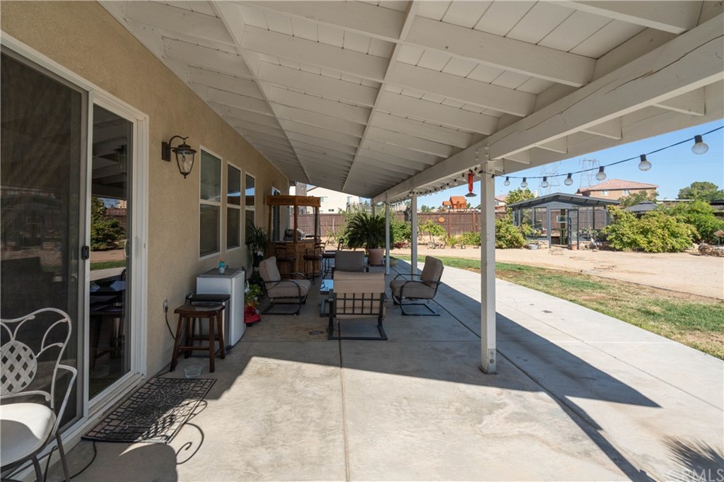 19032 Mono Drive Hesperia, CA 92345 - Photo 21 of 54 a outdoor space with lots of tables a garden view and chairs