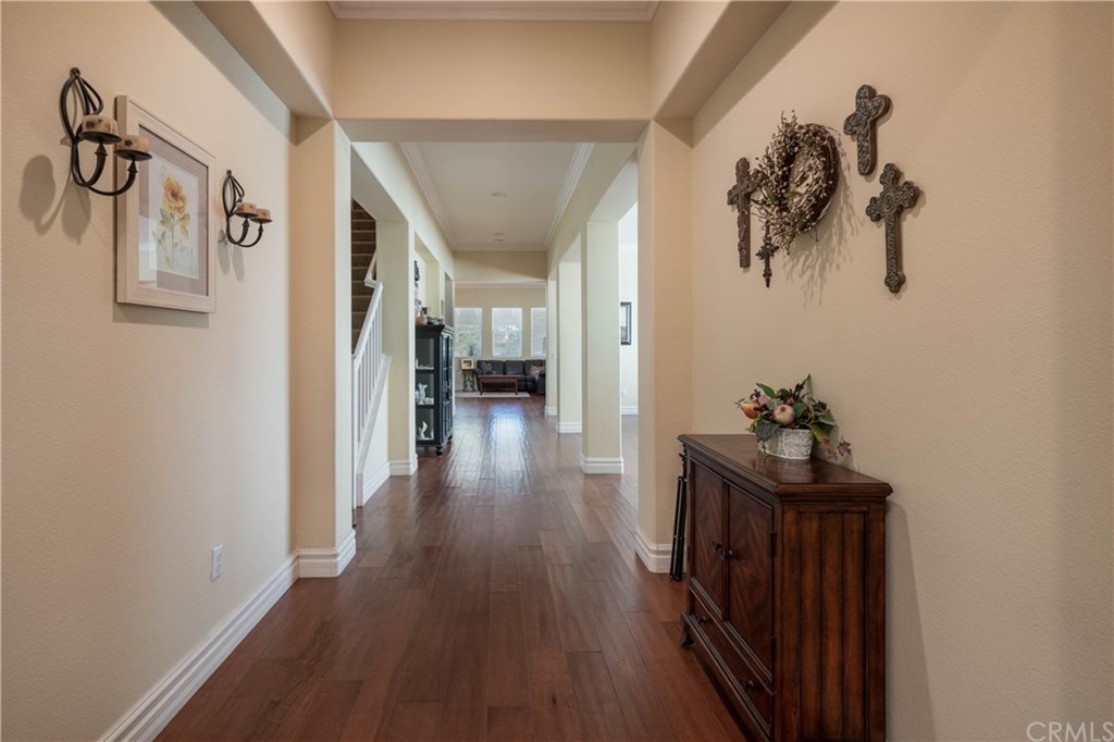 19032 Mono Drive Hesperia, CA 92345 - Photo 25 of 54 a view of a hallway with wooden floor and stairs
