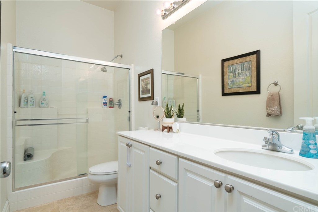19032 Mono Drive Hesperia, CA 92345 - Photo 29 of 54 a bathroom with a sink a toilet and shower