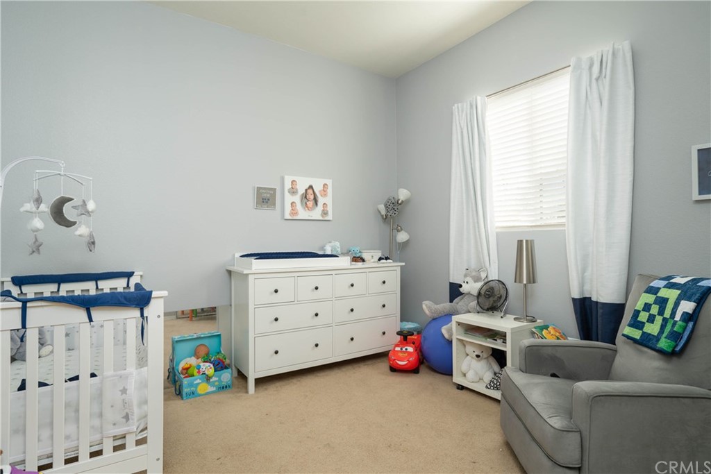 19032 Mono Drive Hesperia, CA 92345 - Photo 30 of 54 a view of a bedroom with furniture and toys