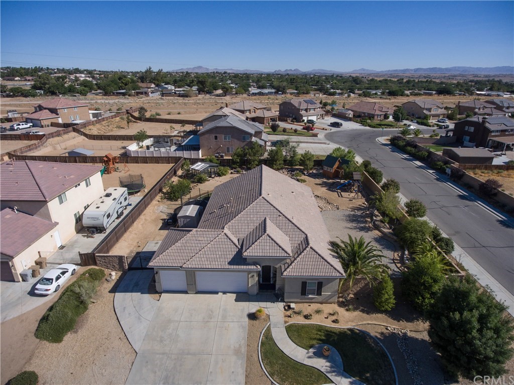 19032 Mono Drive Hesperia, CA 92345 - Photo 3 of 54 an aerial view of a house with a garden