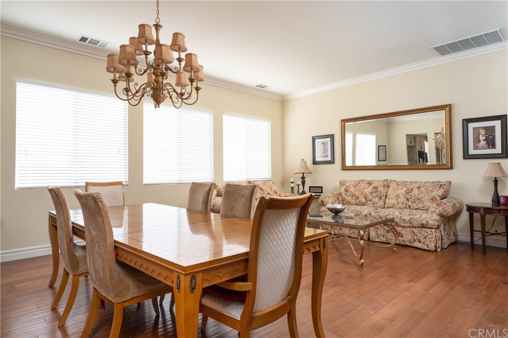 19032 Mono Drive Hesperia, CA 92345 - Photo 34 of 54 a view of a dining room with furniture wooden floor and chandelier