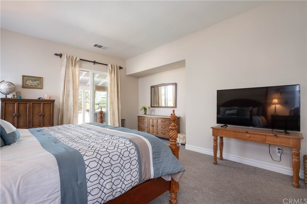 19032 Mono Drive Hesperia, CA 92345 - Photo 38 of 54 a bedroom with a bed and a flat screen tv