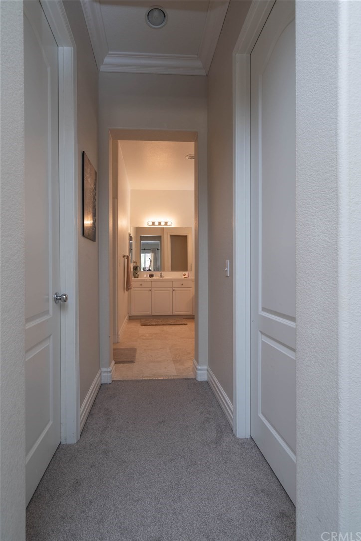 19032 Mono Drive Hesperia, CA 92345 - Photo 39 of 54 a view of a hallway with wooden floor and a living room