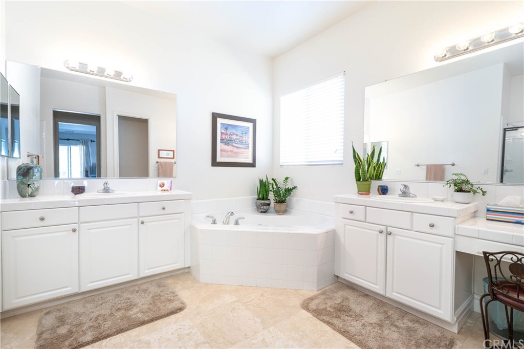19032 Mono Drive Hesperia, CA 92345 - Photo 40 of 54 a spacious bathroom with a double vanity sink mirror and bathtub