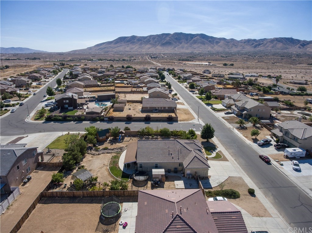 19032 Mono Drive Hesperia, CA 92345 - Photo 9 of 54 an aerial view of residential house and sandy dunes