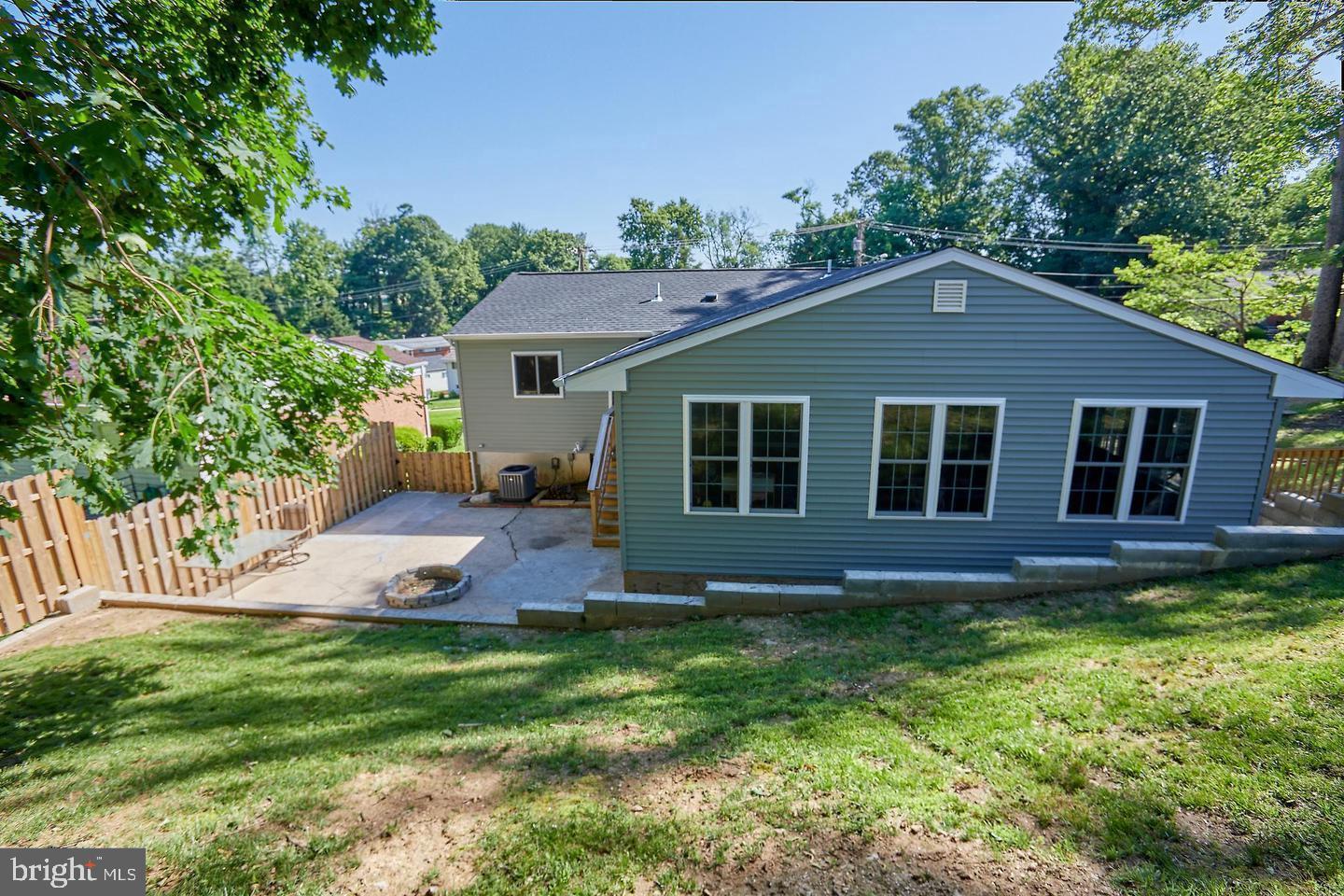 1007 Venice Drive Silver Spring, MD 20904 - Photo 34 of 39 a front view of a house with a garden and yard