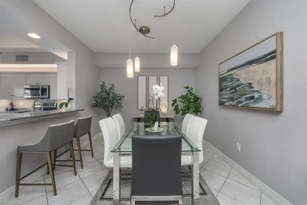 a dining room with furniture and window