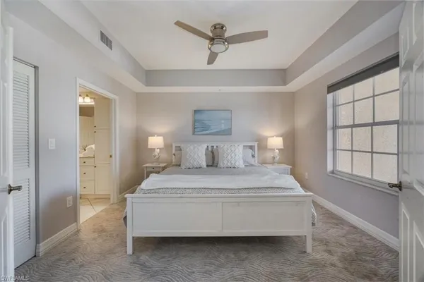 a bedroom with a bed and window