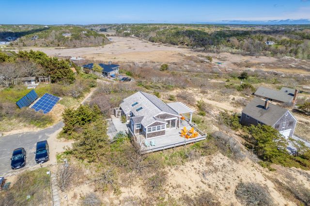 a front view of a house with swimming pool
