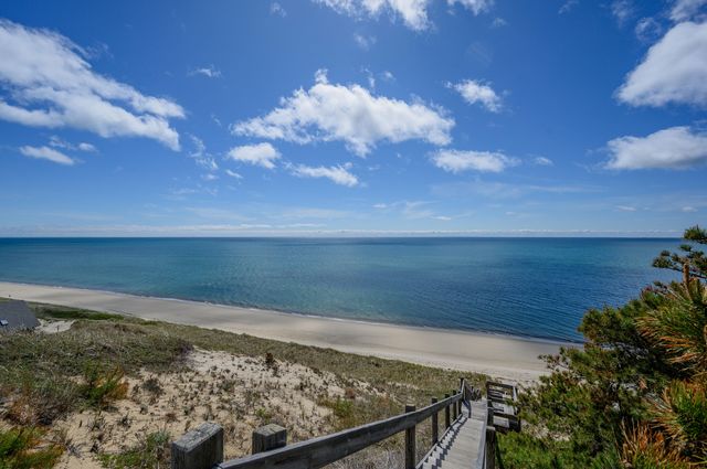 an aerial view of a house with a backyard space