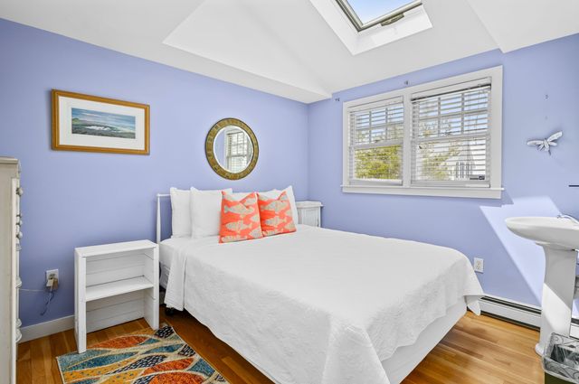 a bedroom with a bed and a table