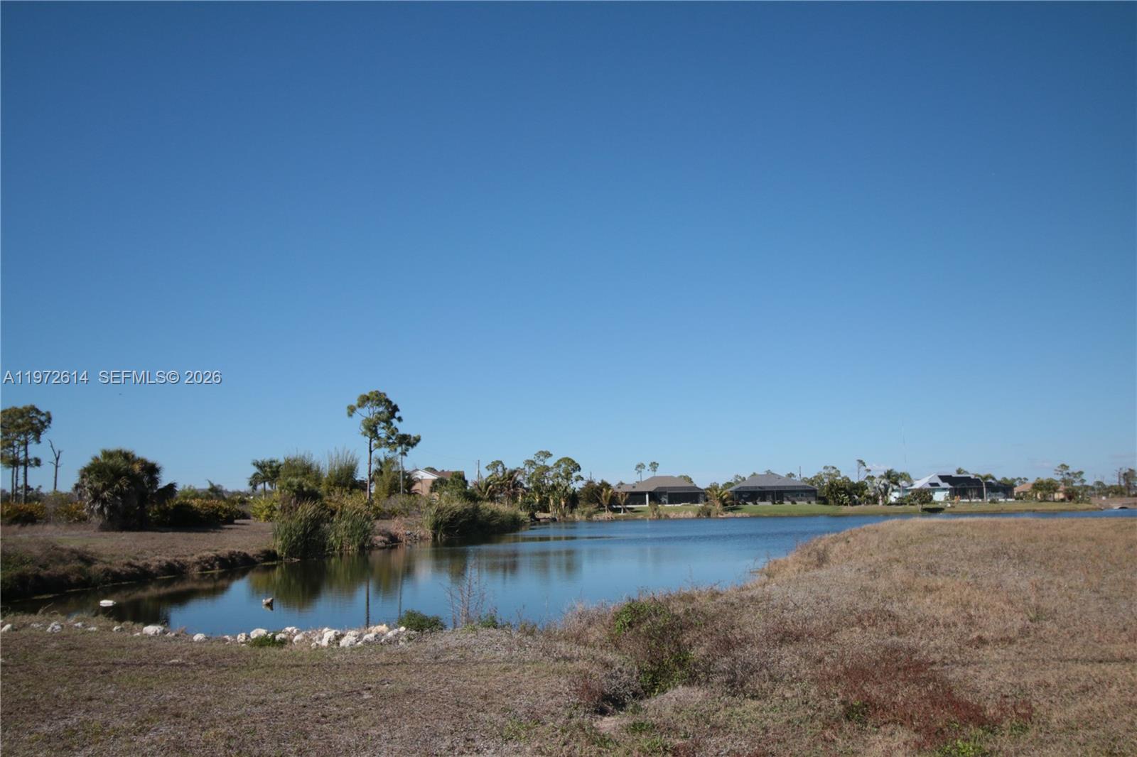 26 Harness Placida, FL 33946 - Photo 11 of 20 a view of a lake with houses