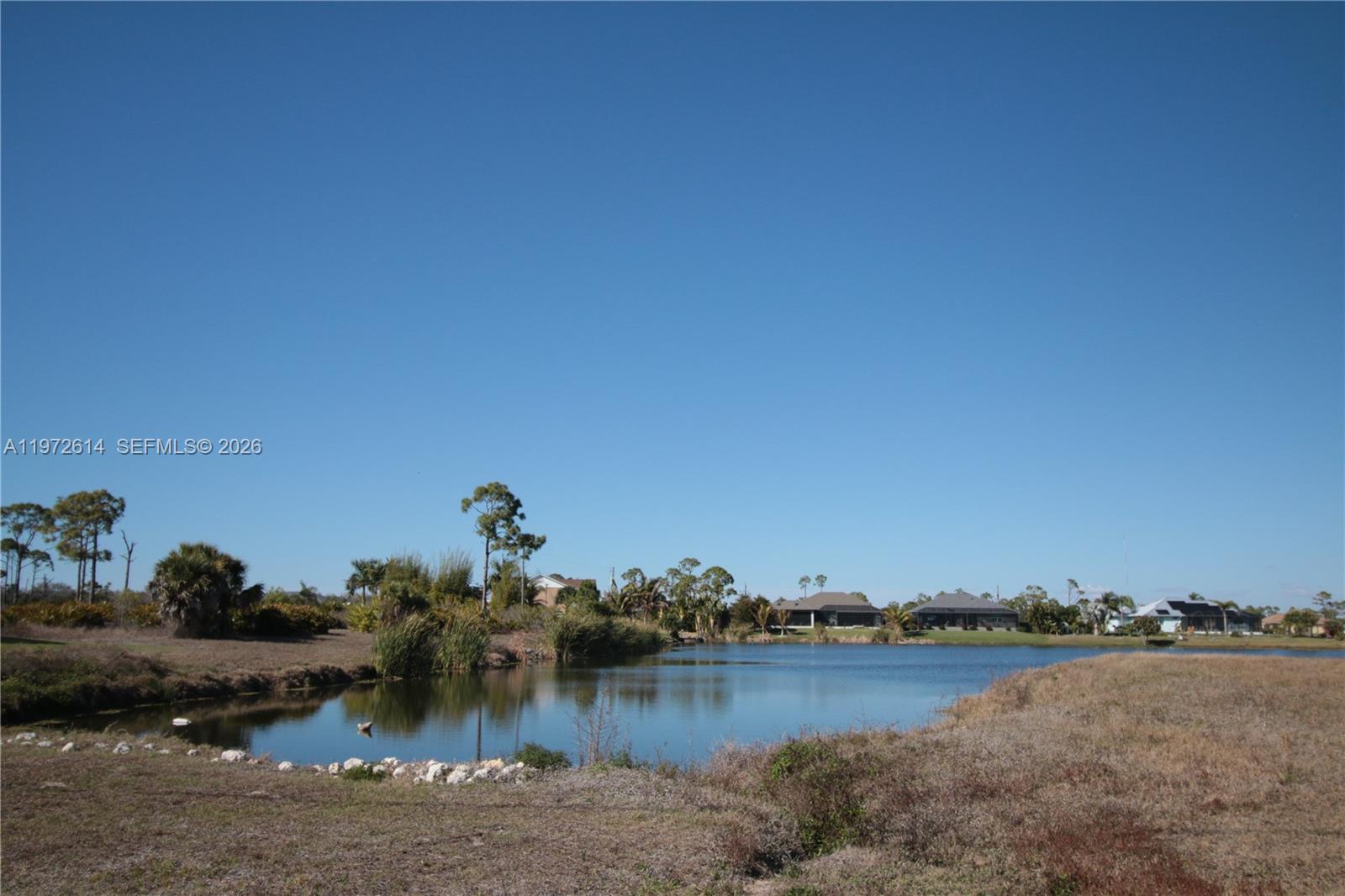 26 Harness Placida, FL 33946 - Photo 13 of 20 a view of a lake with houses