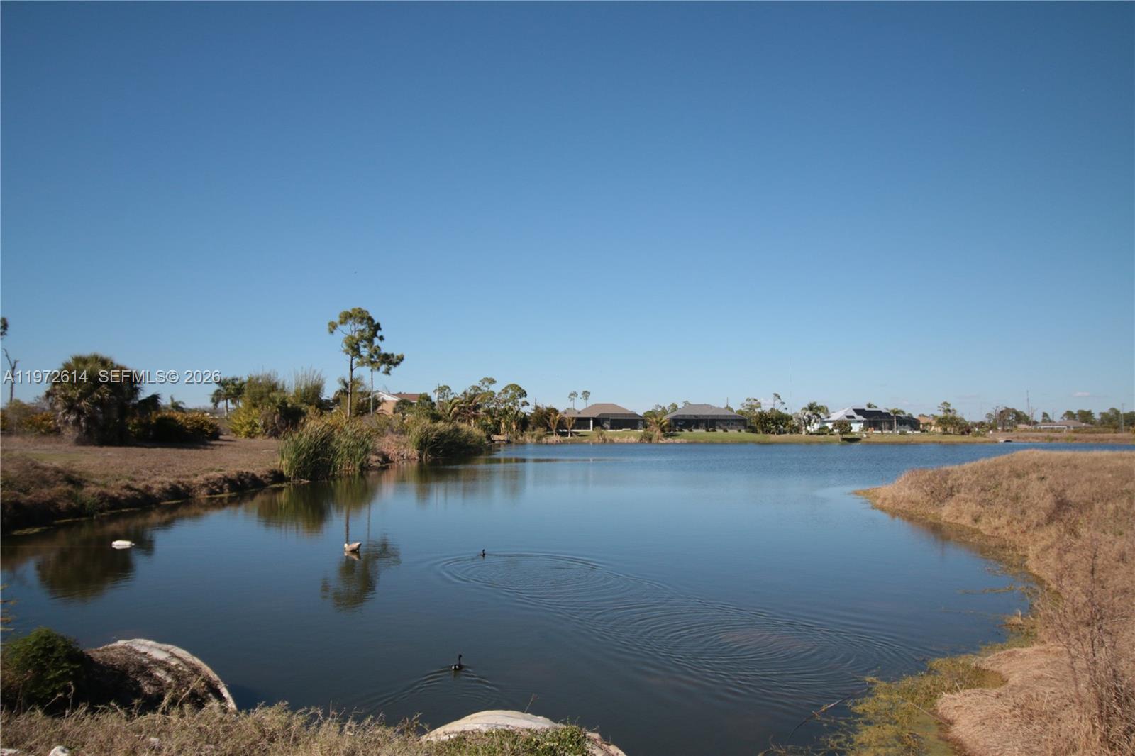 26 Harness Placida, FL 33946 - Photo 14 of 20 a view of a lake with outdoor space