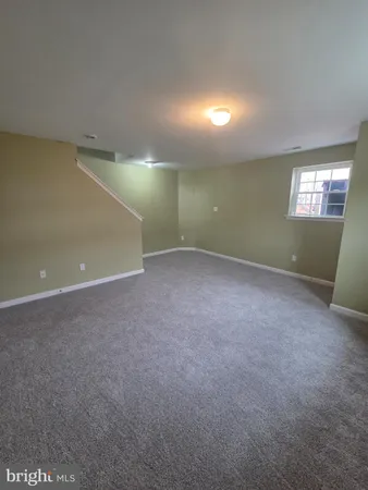 a bed room with furniture and window