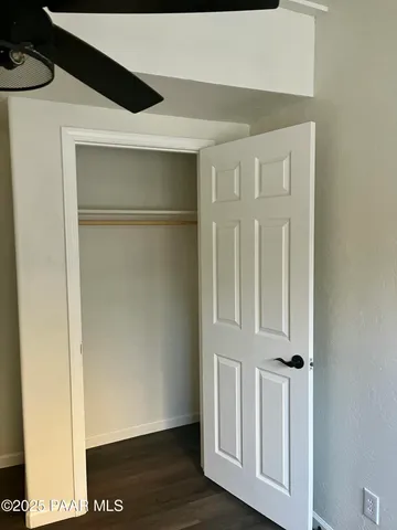 a view of front door with wooden floor