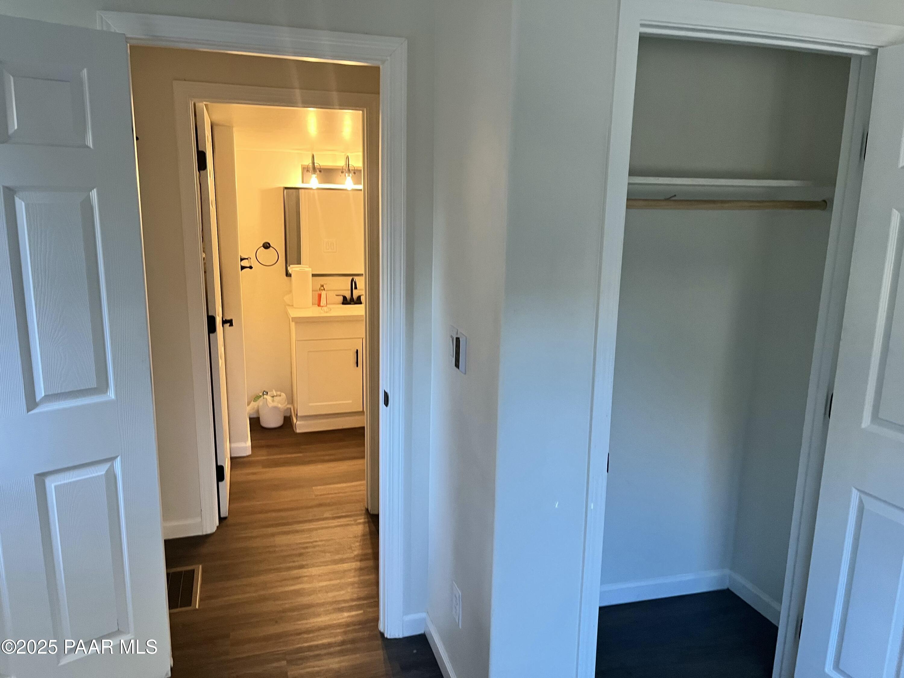 415 Comfort Avenue Prescott, AZ 86301 - Photo 10 of 10 a view of a hallway with wooden floor and a bedroom