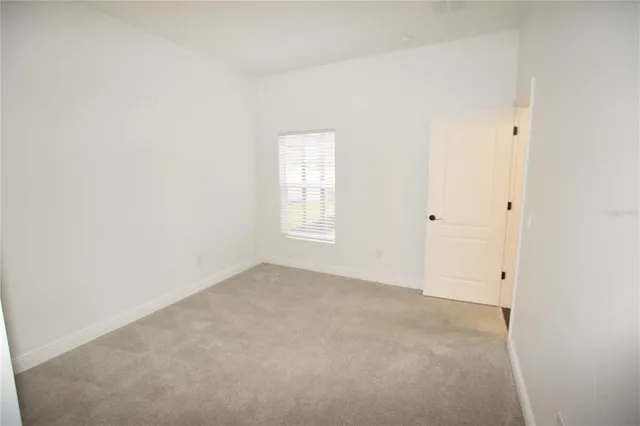 a bathroom with a granite countertop sink toilet a mirror and bathtub