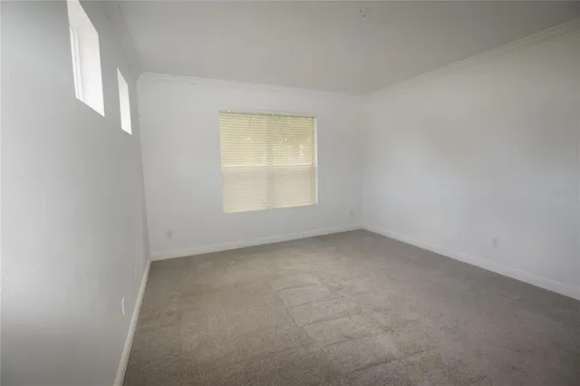 a kitchen with a sink and a mirror