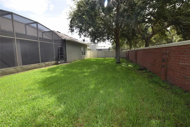 a backyard of a house with lots of green space