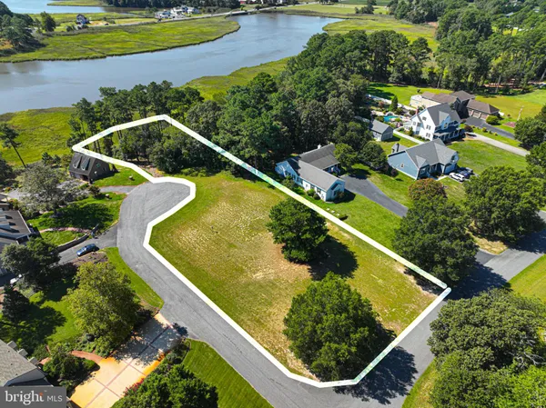 an aerial view of swimming pool with a yard and outdoor seating