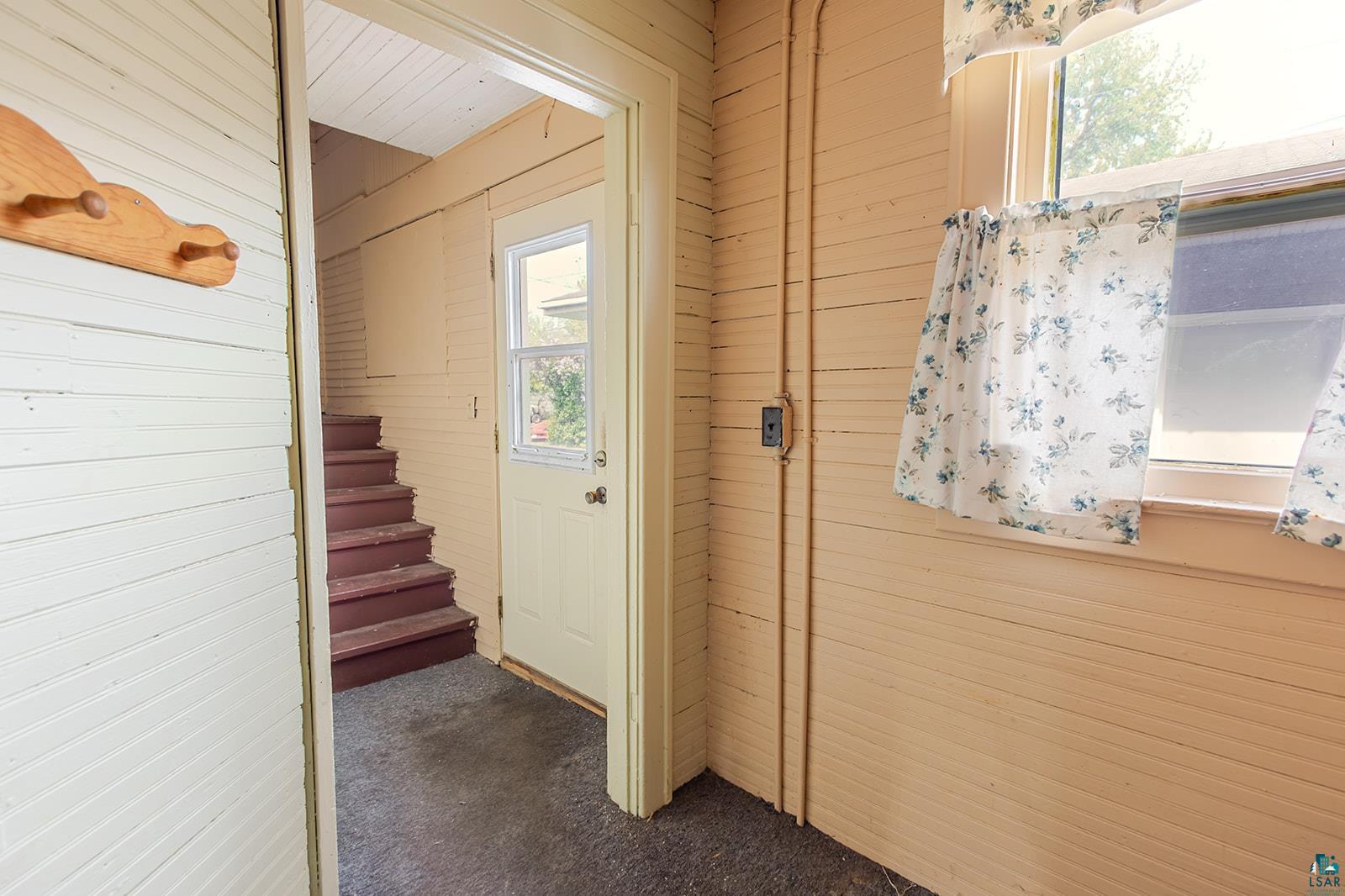 438 9th Street Cloquet, MN 55720 - Photo 26 of 27 Rear Entry mudroom with secondary access to upper level.