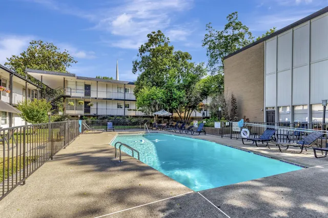 a view of a swimming pool with a patio