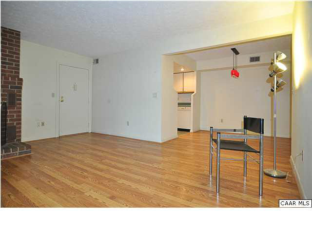 120 Turtle Creek Road, Unit 4 Charlottesville, VA 22901 - Photo 5 of 23 a room with a bed and a flat screen tv