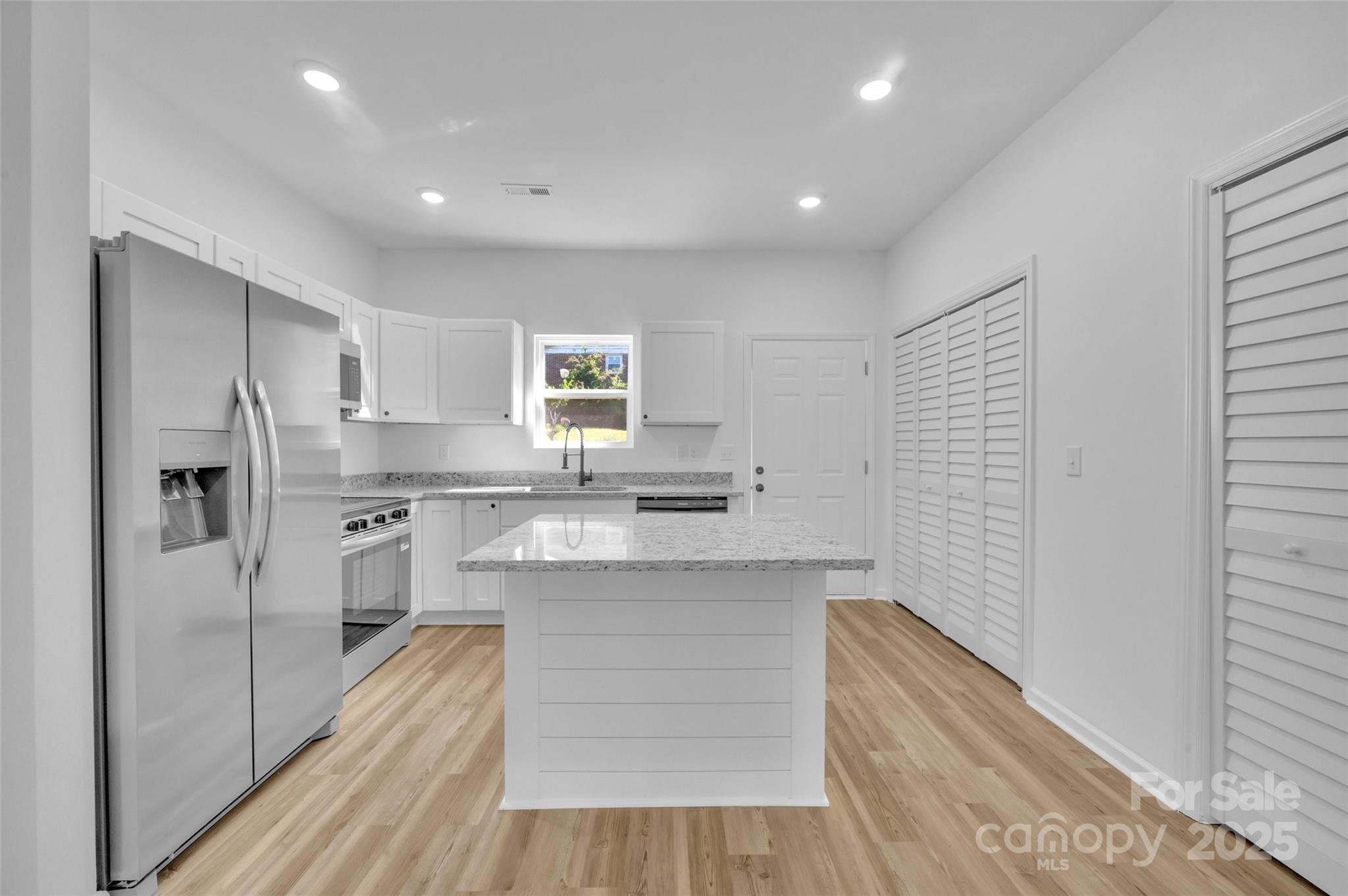 504 Christopher Lane Chester, SC 29706 - Photo 6 of 18 a kitchen with stainless steel appliances granite countertop a refrigerator and a sink