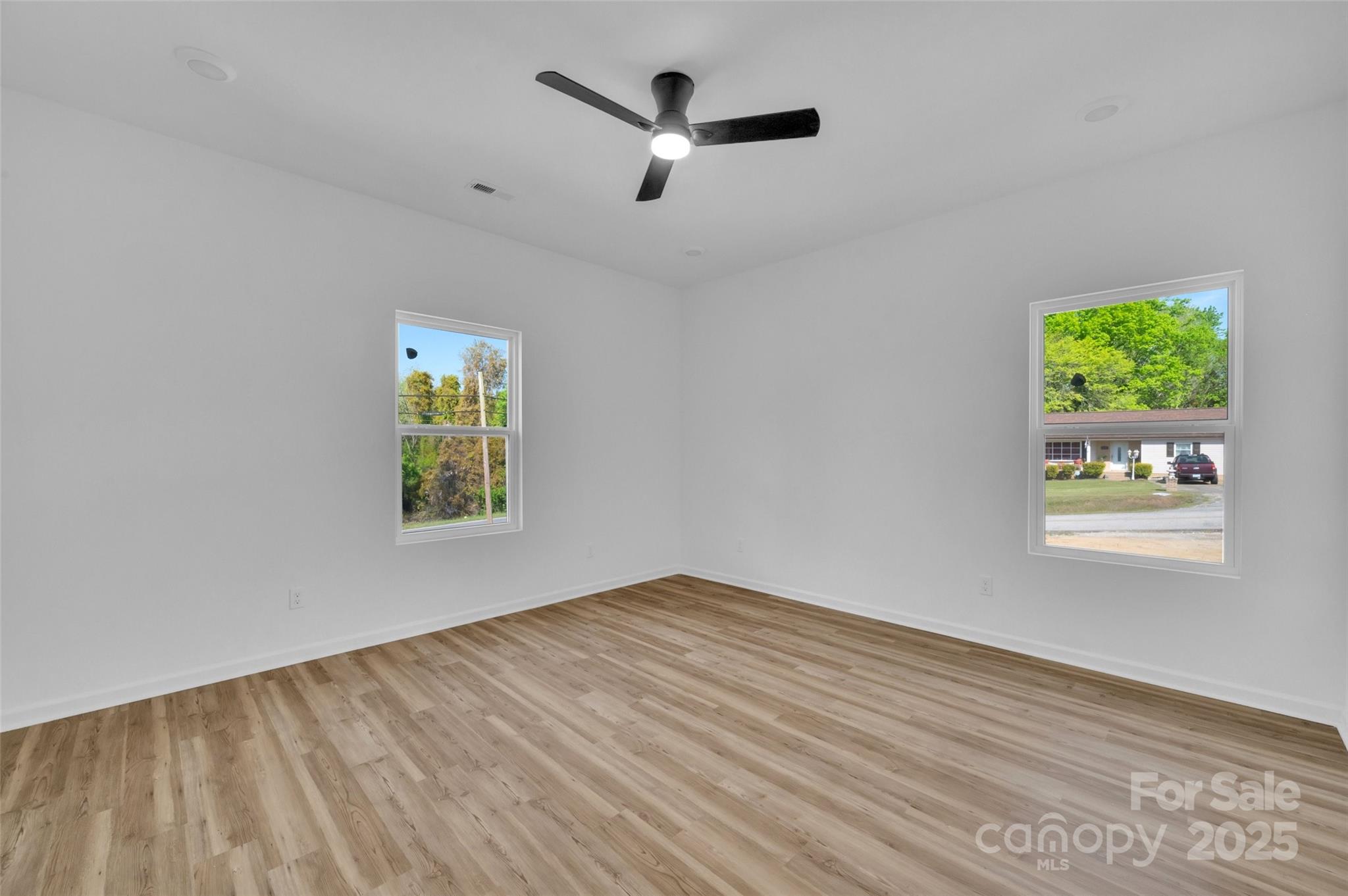 504 Christopher Lane Chester, SC 29706 - Photo 7 of 18 a view of empty room with window and ceiling fan