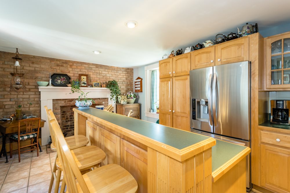 568 Whetstone Draft Road Mount Solon, VA 22843 - Photo 17 of 49 a kitchen with a refrigerator a stove top oven and a dining table