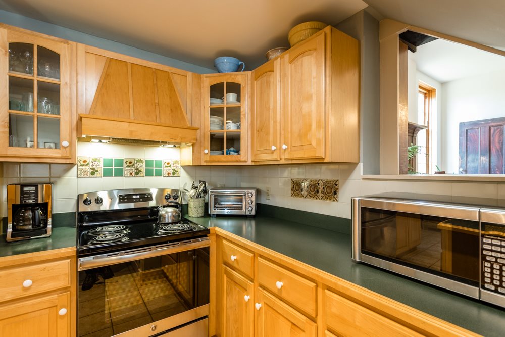 568 Whetstone Draft Road Mount Solon, VA 22843 - Photo 19 of 49 a kitchen with stainless steel appliances granite countertop a stove and a microwave
