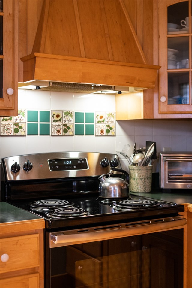568 Whetstone Draft Road Mount Solon, VA 22843 - Photo 21 of 49 a stove top oven sitting inside of a kitchen
