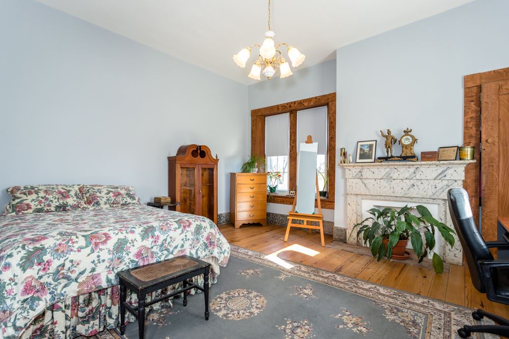 568 Whetstone Draft Road Mount Solon, VA 22843 - Photo 27 of 49 a bedroom with furniture and a chandelier