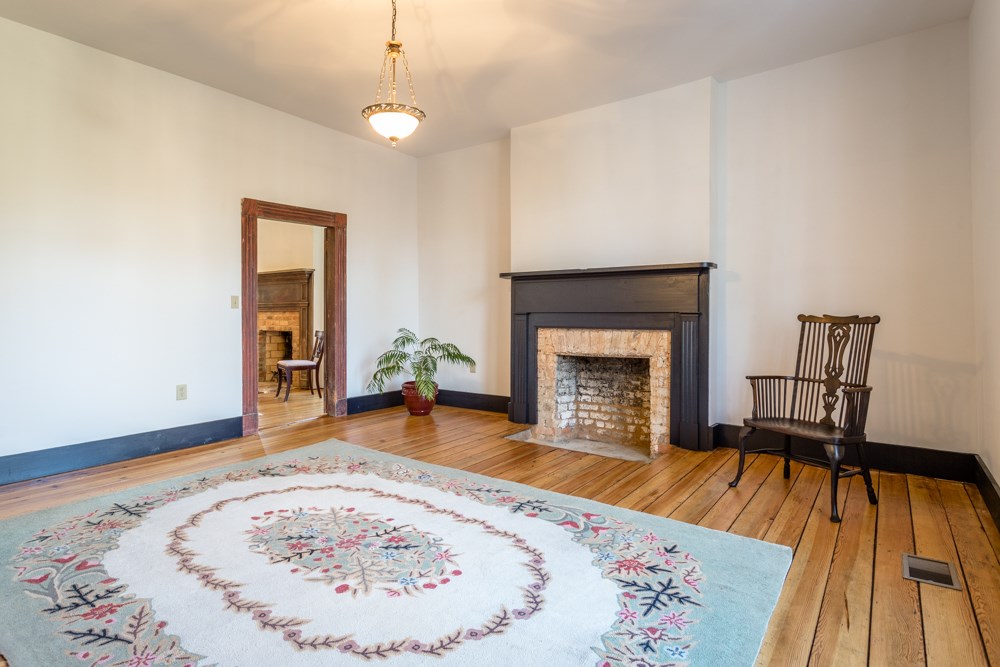568 Whetstone Draft Road Mount Solon, VA 22843 - Photo 8 of 49 a view of a livingroom with wooden floor and a fireplace