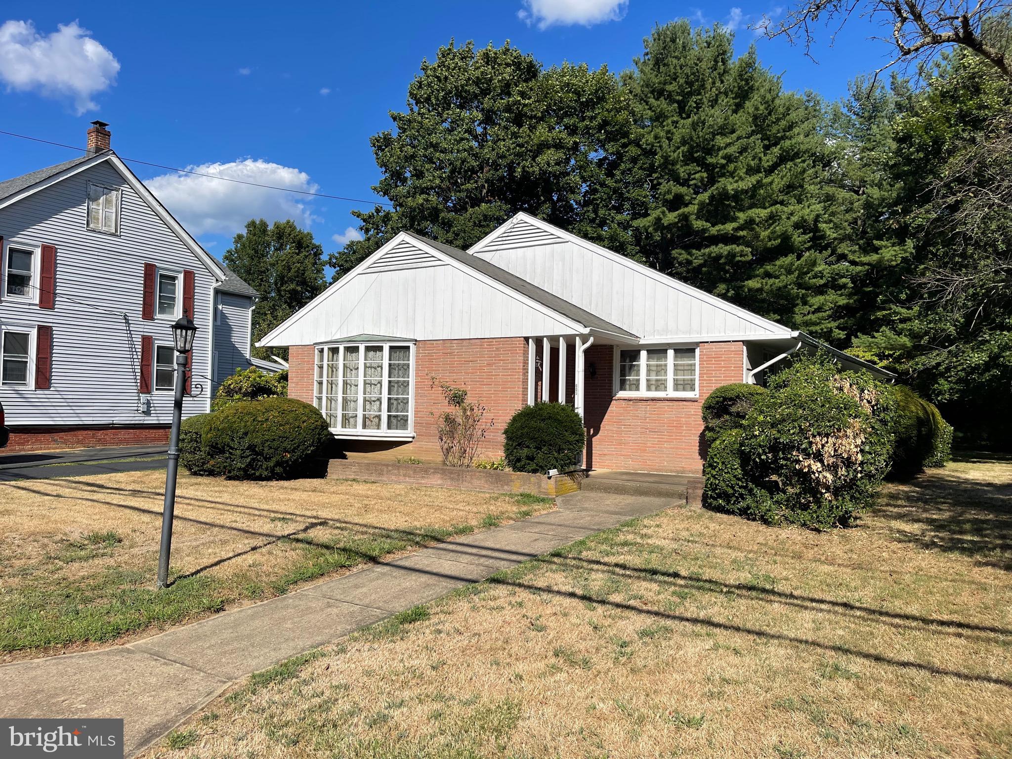 605 North Main Street Hightstown, NJ 08520 - Photo 1 of 20 a view of a house with backyard and trees