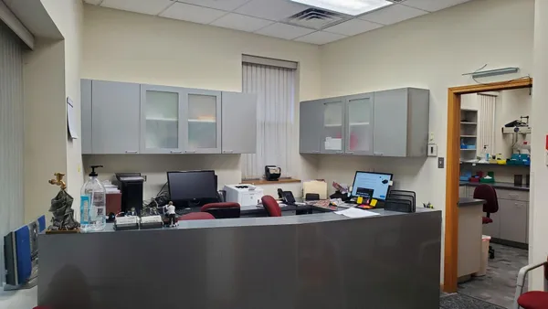a kitchen with furniture a refrigerator and cabinets
