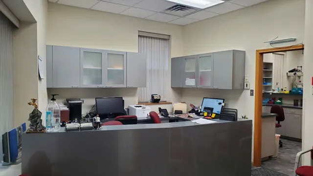 a kitchen with furniture a refrigerator and cabinets