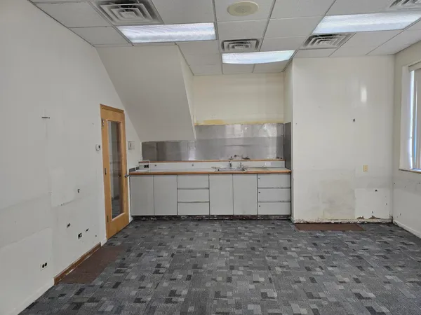 a kitchen with stainless steel appliances a refrigerator and a sink