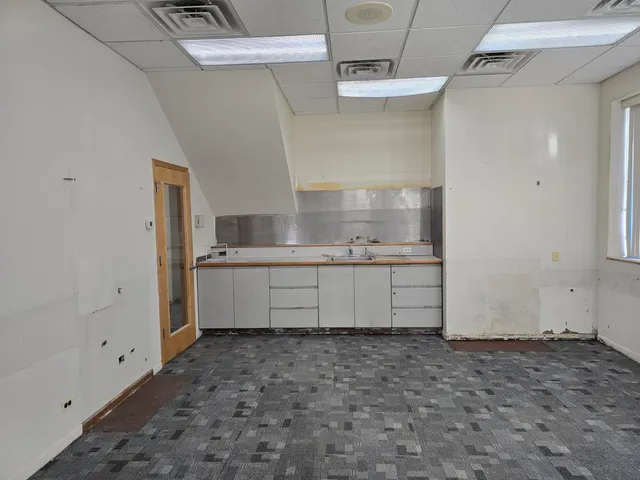 a kitchen with stainless steel appliances a refrigerator and a sink