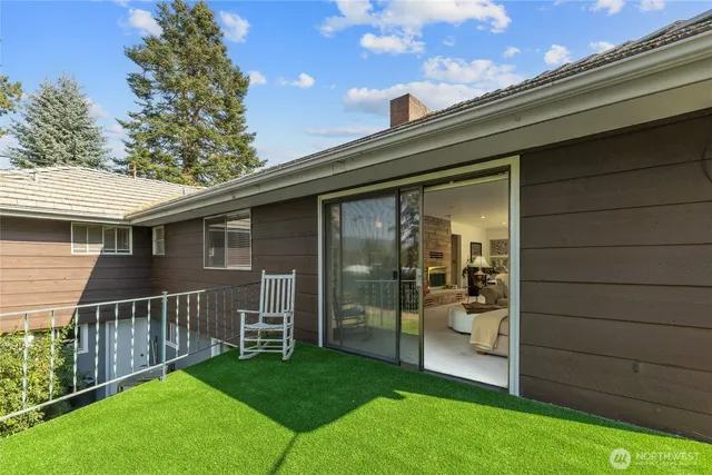 a view of house with backyard outdoor seating and green space