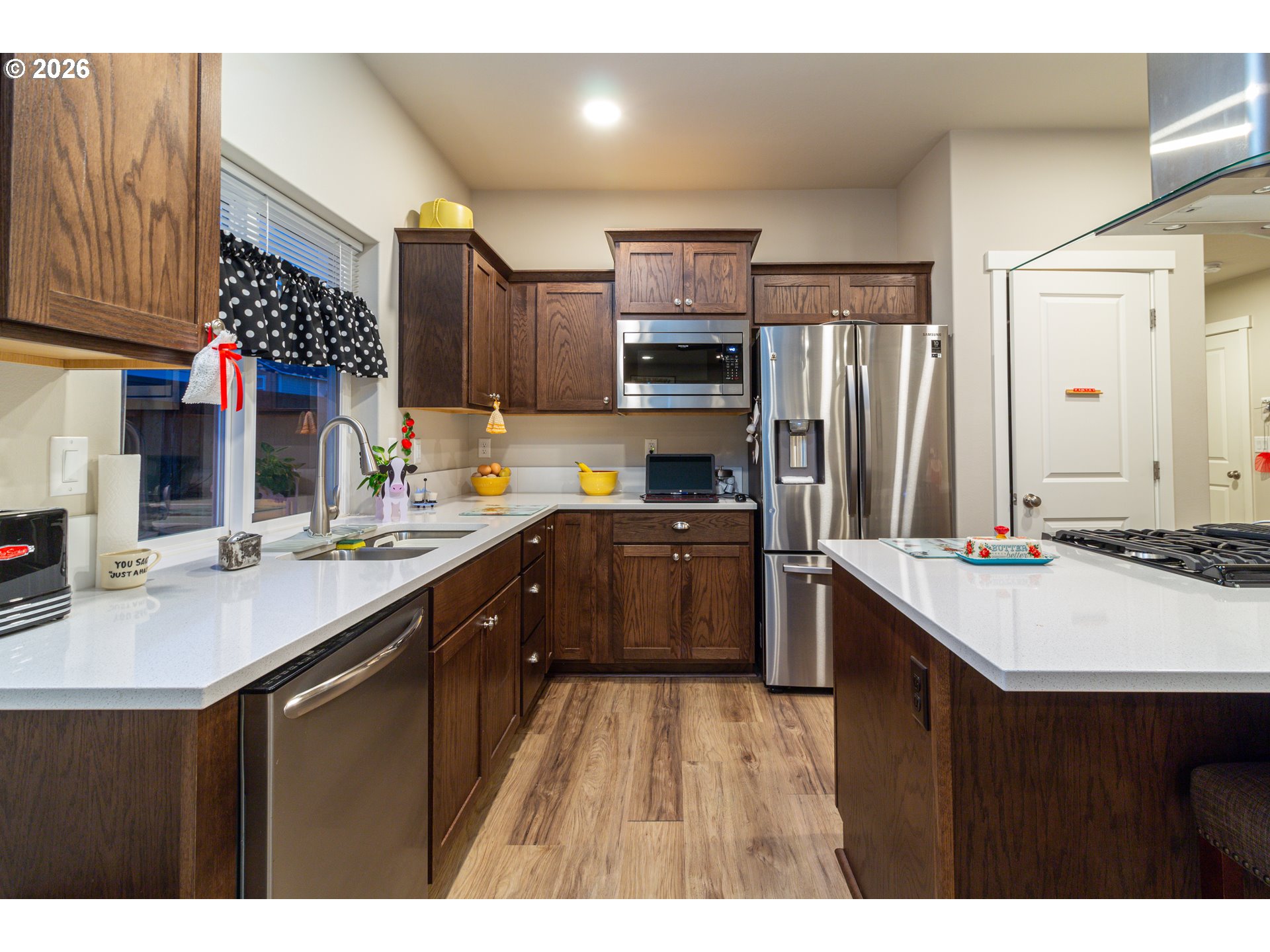 529 East Legacy Avenue Hermiston, OR 97838 - Photo 7 of 30 a kitchen with a sink refrigerator and cabinets