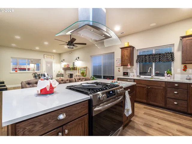 a kitchen with a stove a sink and a refrigerator