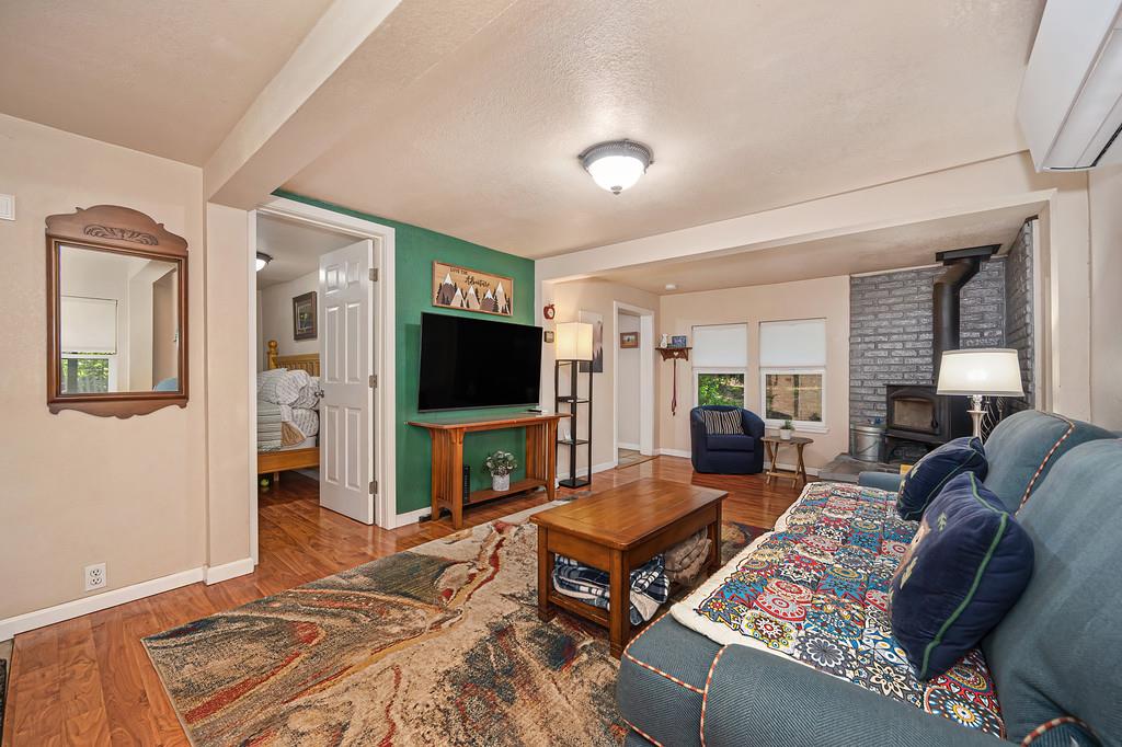 6252 Pony Express Trail Pollock Pines, CA 95726 - Photo 12 of 43 a living room with furniture and a flat screen tv
