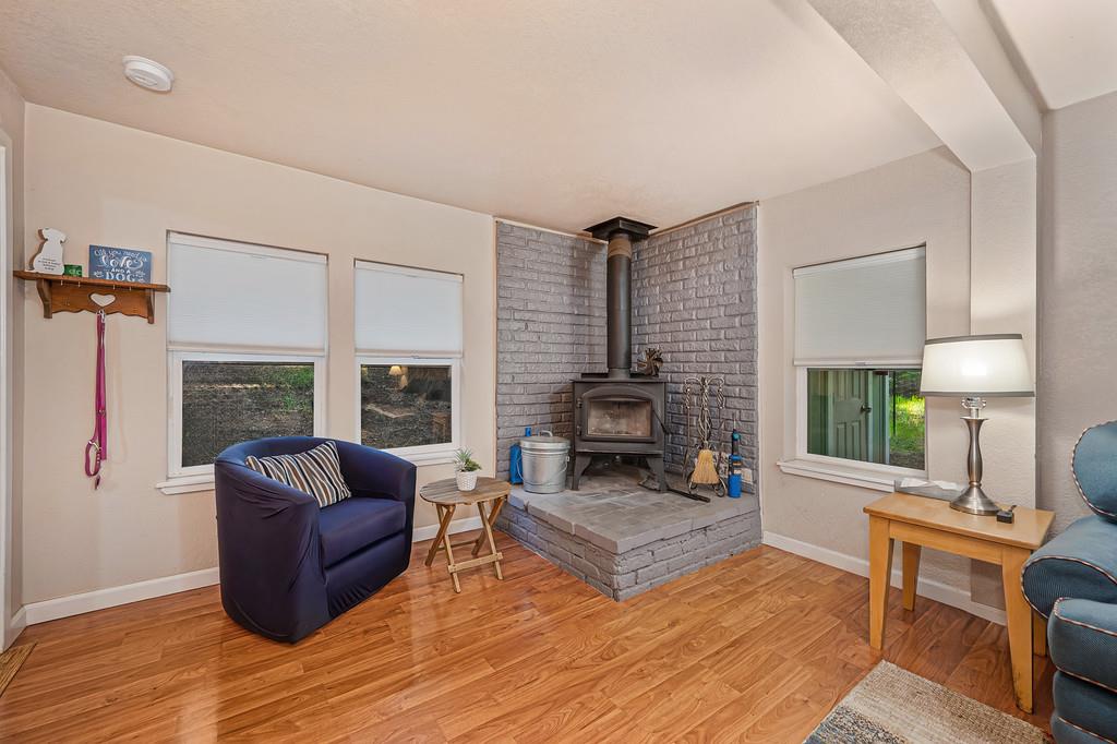 6252 Pony Express Trail Pollock Pines, CA 95726 - Photo 13 of 43 a living room with furniture and a fireplace
